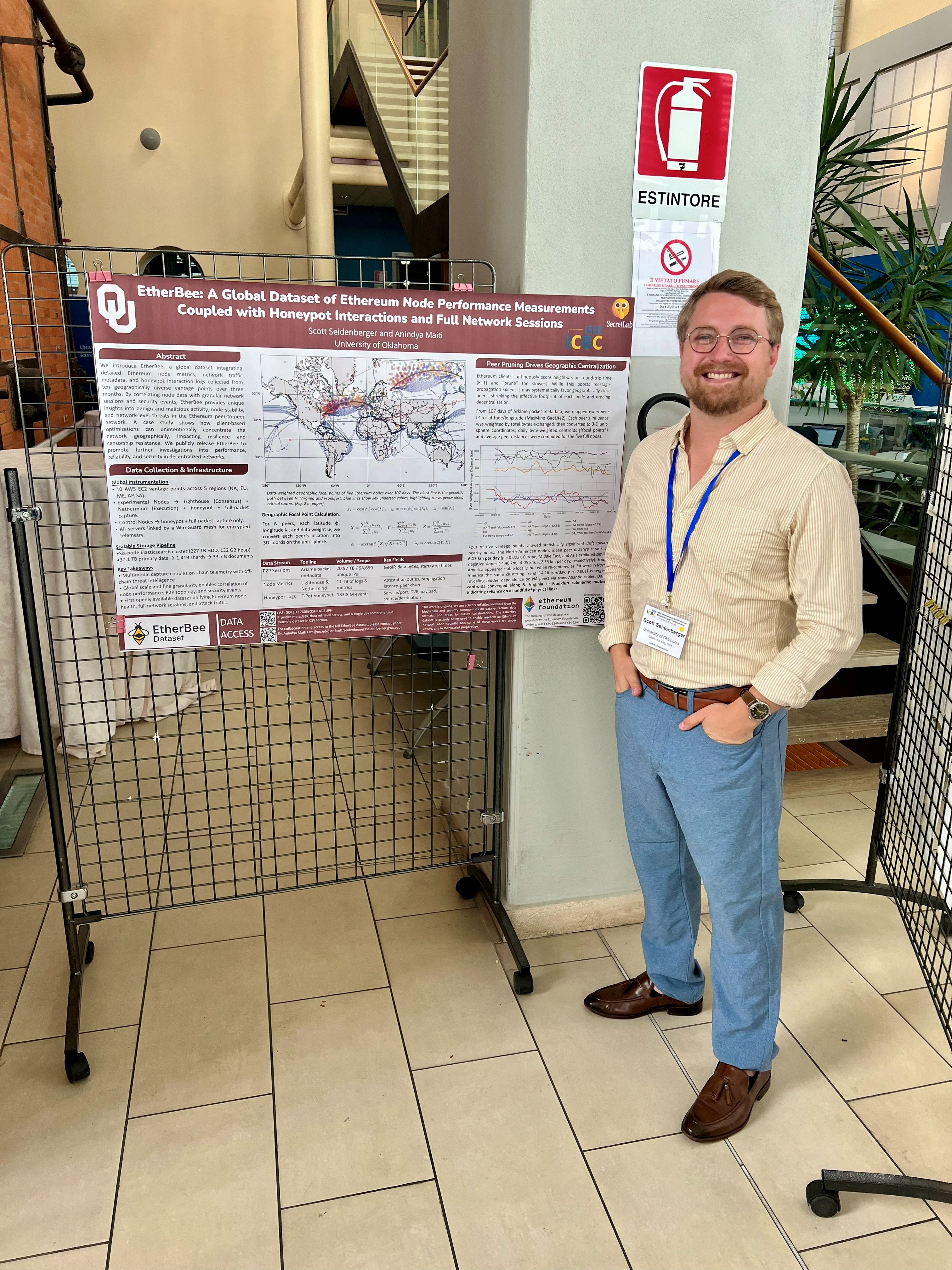 Scott Seidenberger with the EtherBee poster at IEEE ICBC 2025 in Pisa, Italy.